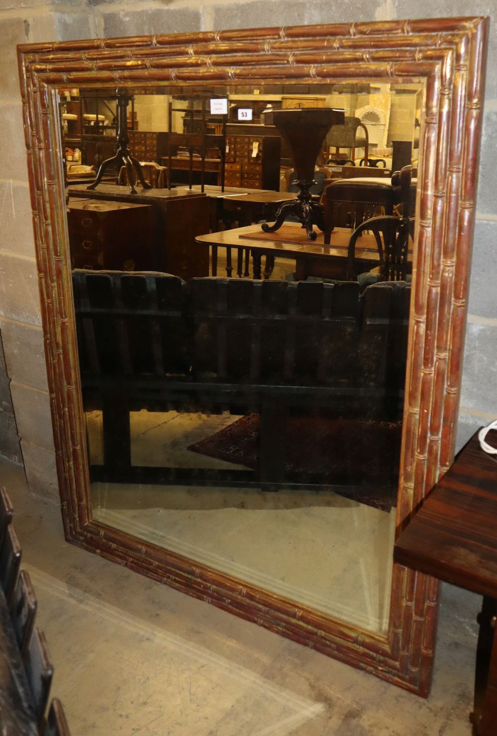 A large bamboo effect wall mirror, with bevelled plate, W.122cm, H.153cm